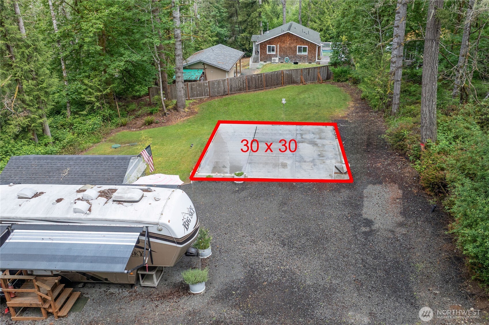 151 East Hillside Drive Belfair, WA 98528 - Photo 6 of 24 a sign that is sitting on a wooden bench in a yard