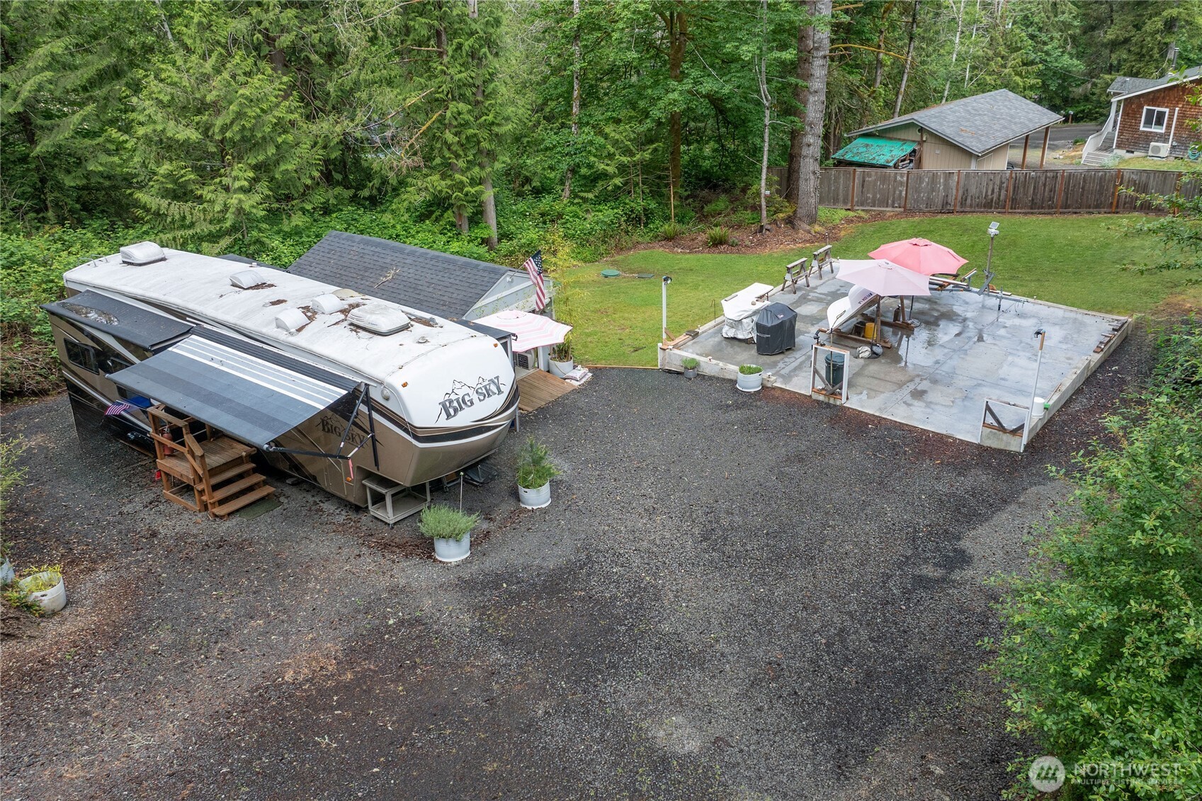 151 East Hillside Drive Belfair, WA 98528 - Photo 8 of 24 a view of a backyard with a table and chairs