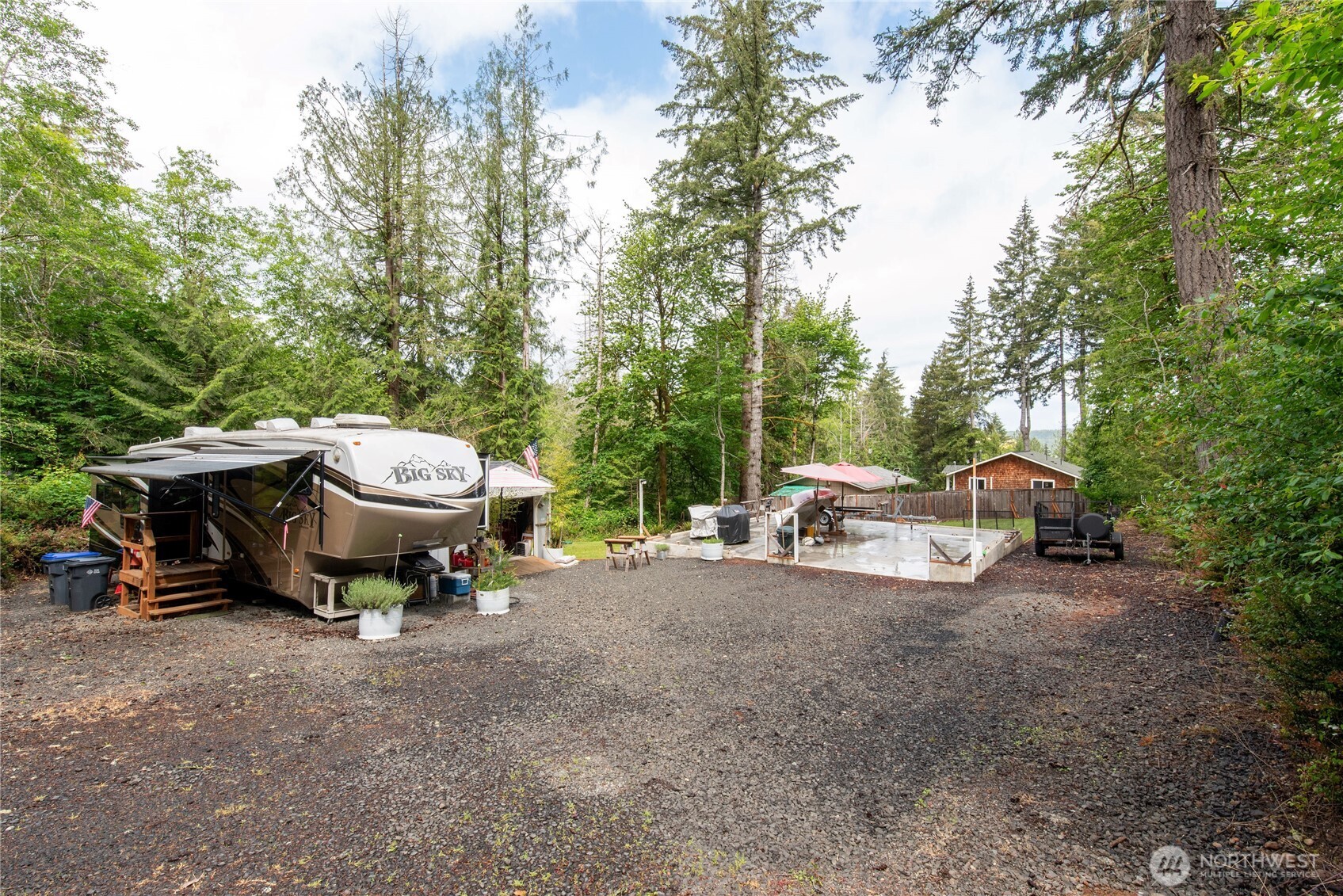 151 East Hillside Drive Belfair, WA 98528 - Photo 9 of 24 a view of a backyard with a sitting area and slide