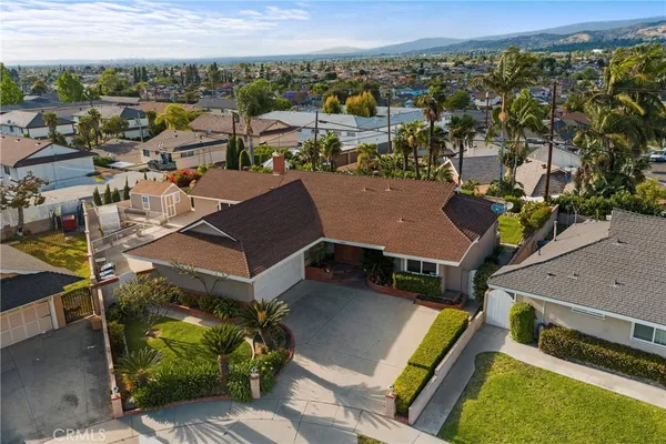 an aerial view of a residential houses with outdoor space