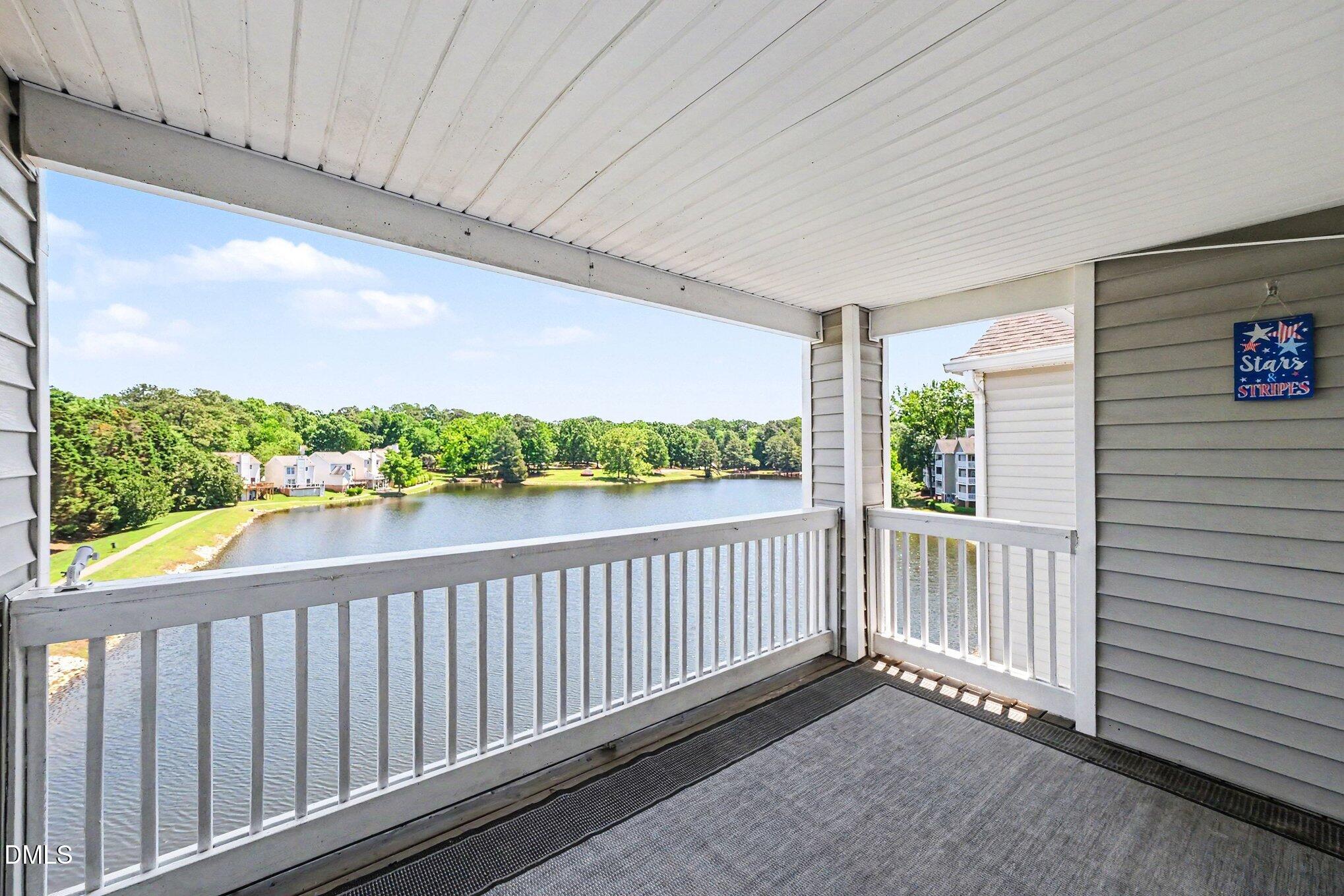 132 Springfork Drive Cary, NC 27513 - Photo 5 of 28 a view of a porch with wooden floor