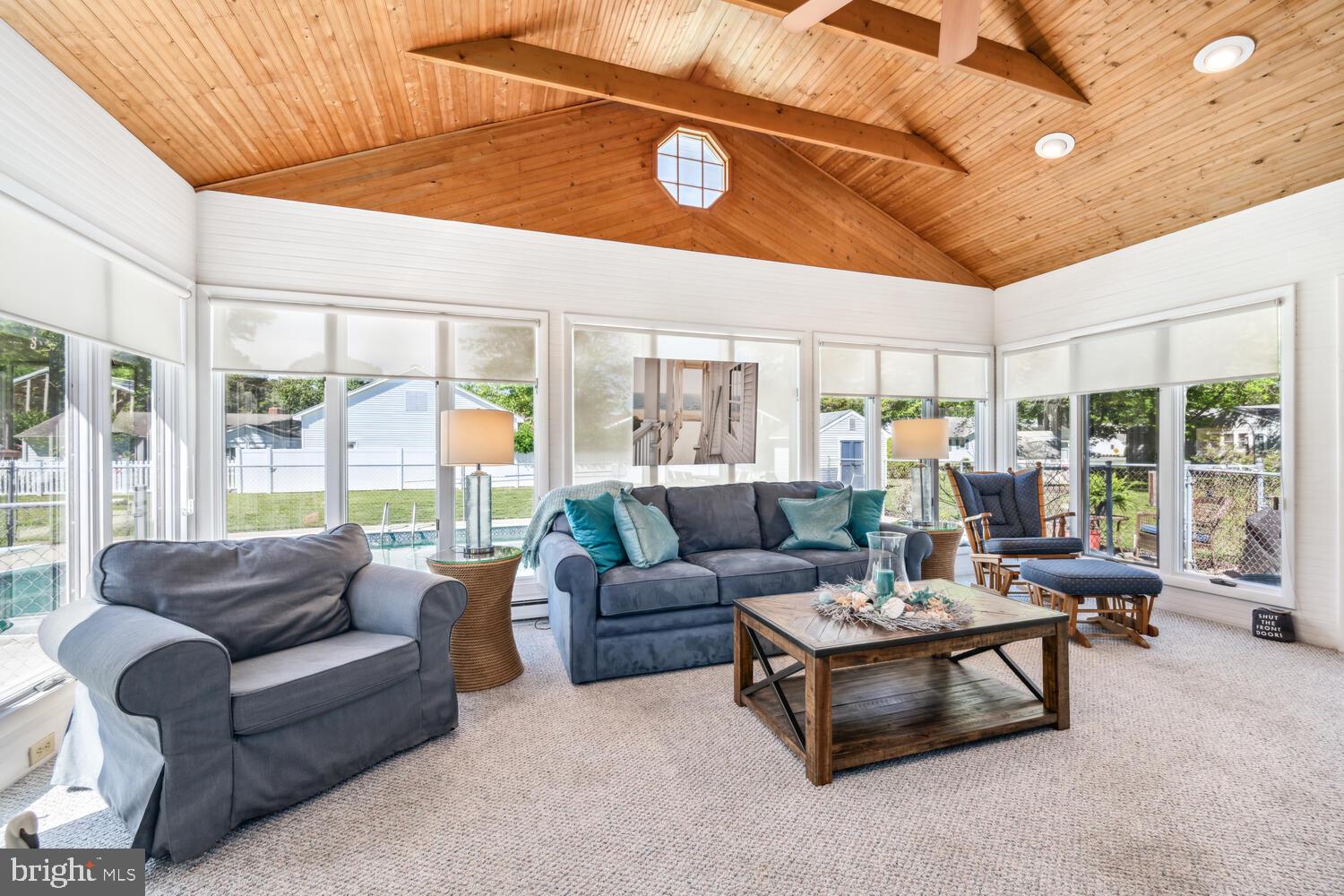 3 Oriole Drive Cambridge, MD 21613 - Photo 16 of 46 a living room with furniture and a large window