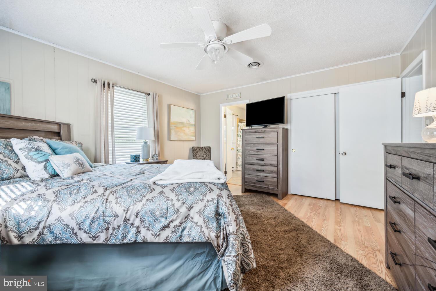 3 Oriole Drive Cambridge, MD 21613 - Photo 25 of 46 a bedroom with a bed and a television