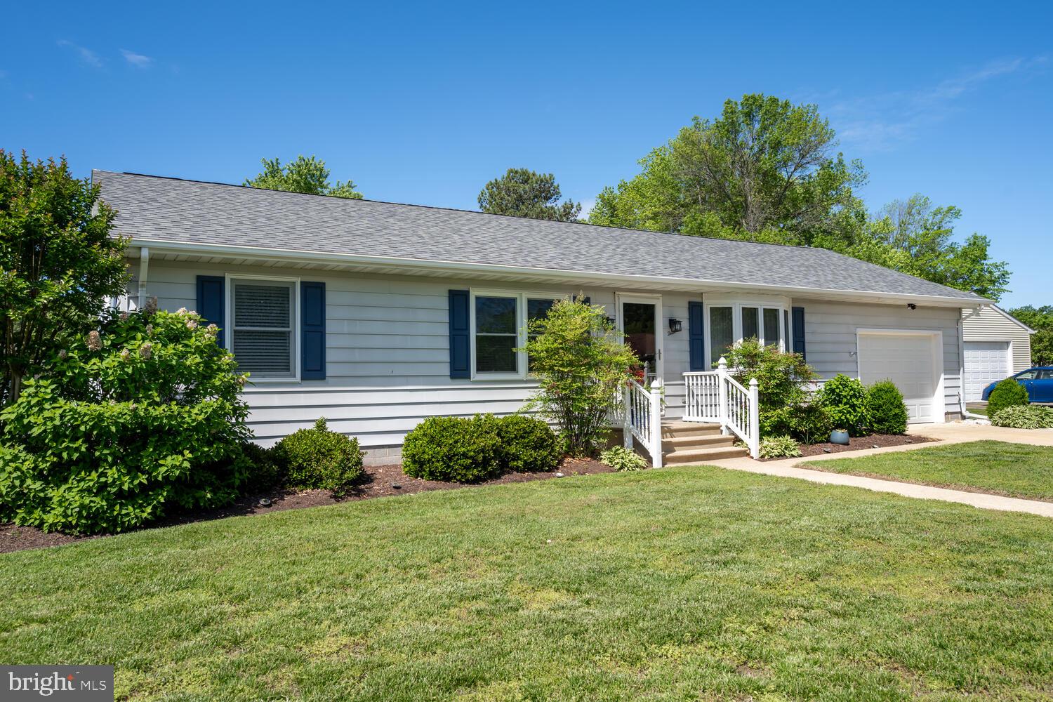 3 Oriole Drive Cambridge, MD 21613 - Photo 28 of 46 a front view of a house with a yard