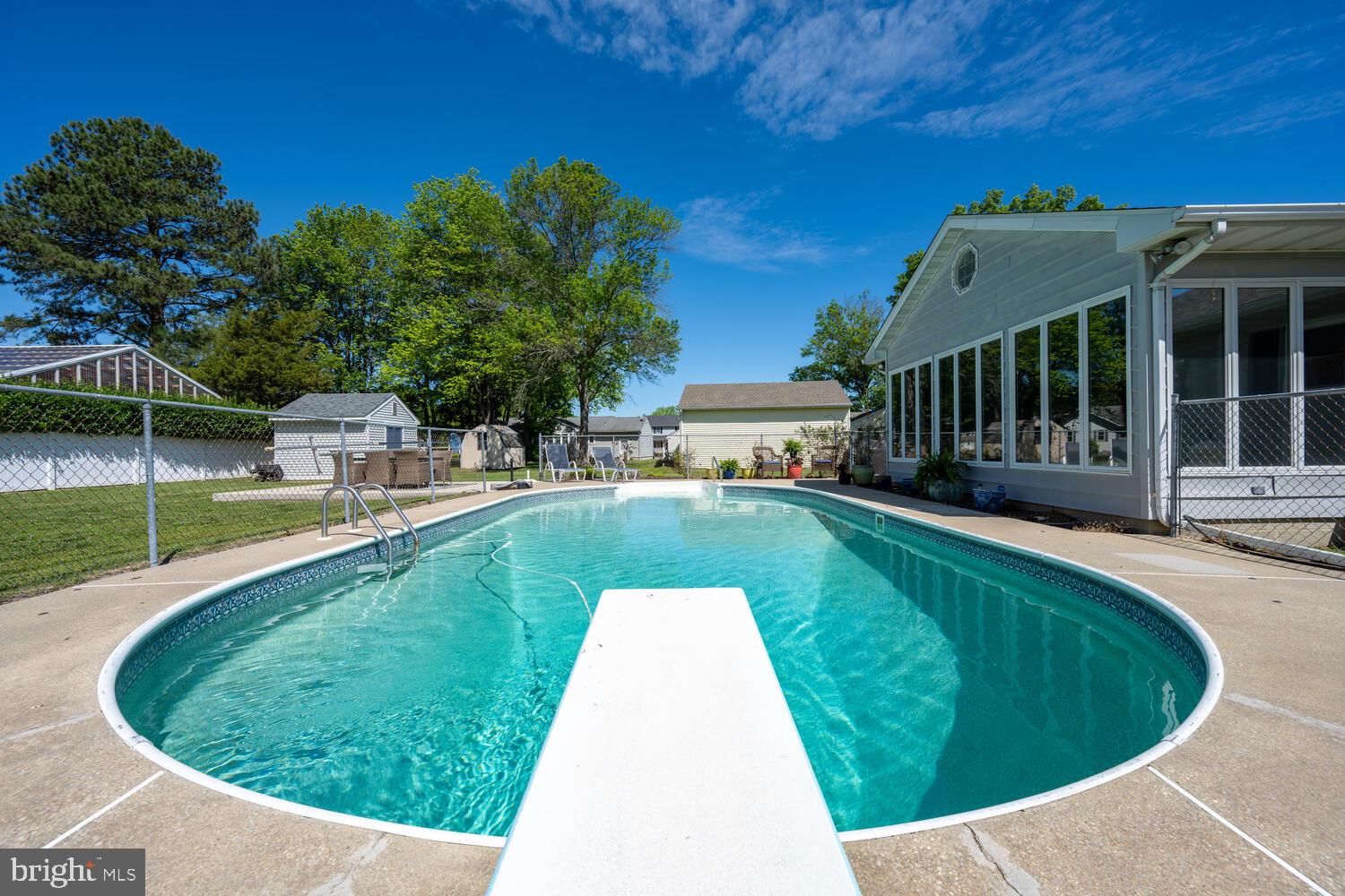 3 Oriole Drive Cambridge, MD 21613 - Photo 34 of 46 a view of a house with swimming pool and a yard