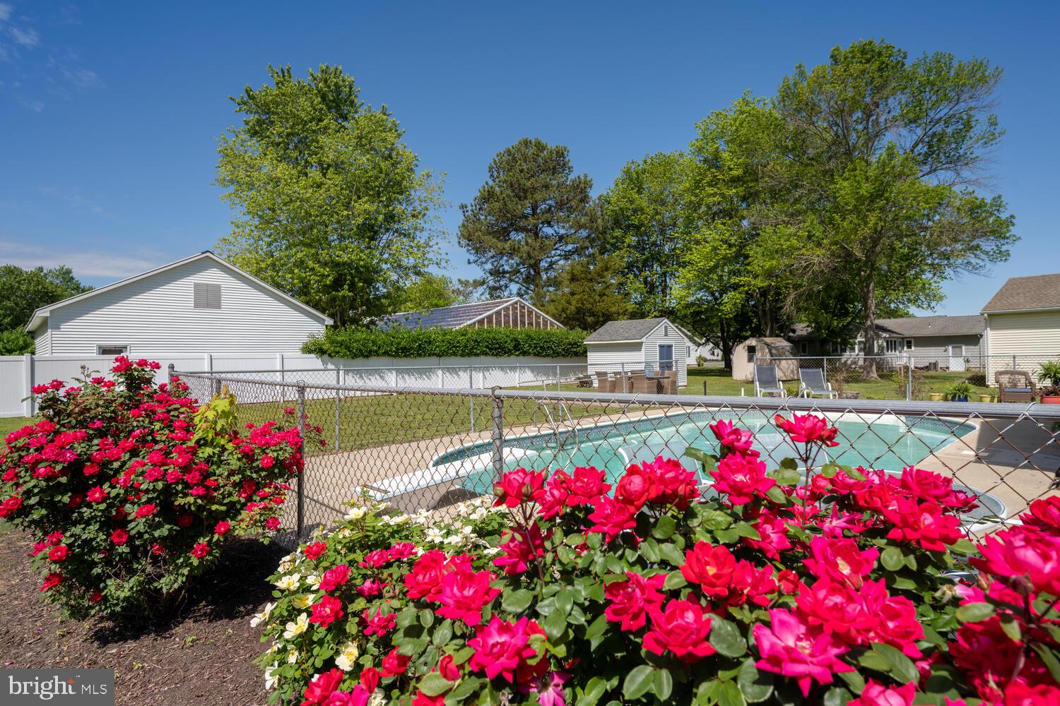 3 Oriole Drive Cambridge, MD 21613 - Photo 37 of 46 a view of swimming pool with sitting area and flowers