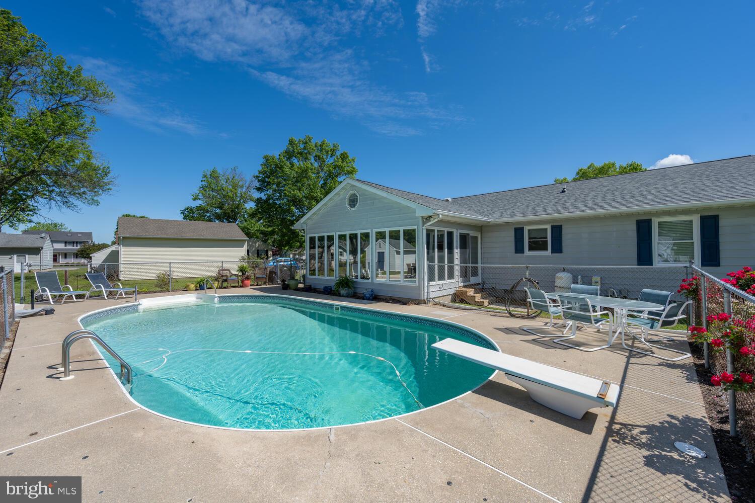 3 Oriole Drive Cambridge, MD 21613 - Photo 5 of 46 a view of a house with swimming pool and sitting area