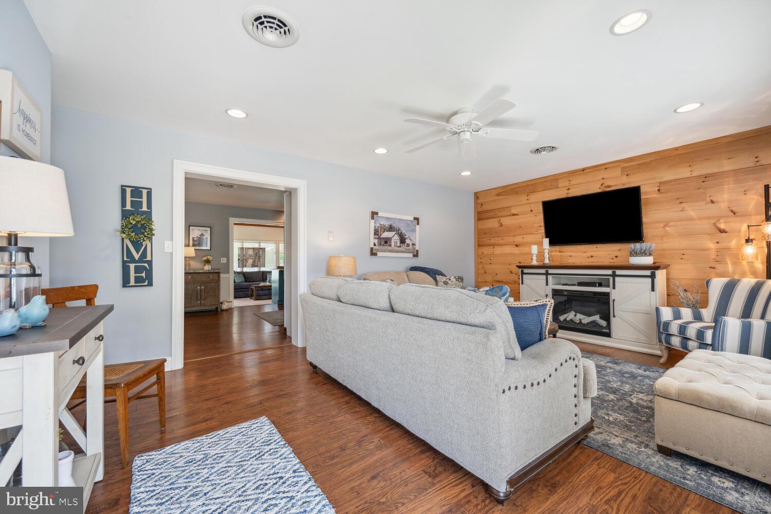 3 Oriole Drive Cambridge, MD 21613 - Photo 7 of 46 a living room with furniture and a flat screen tv