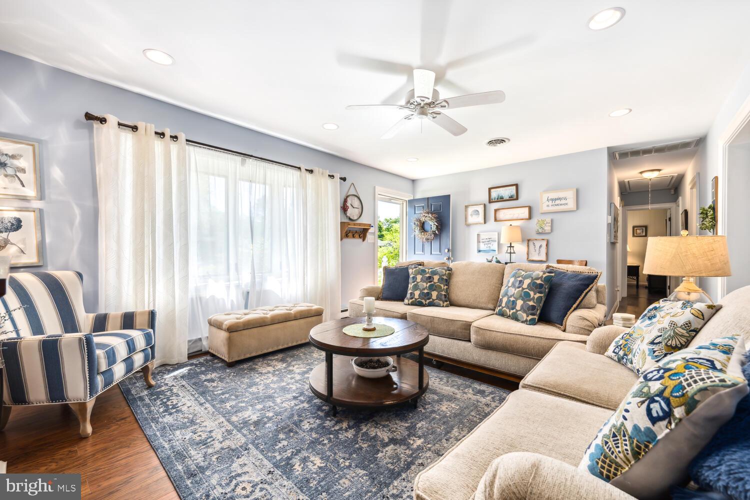 3 Oriole Drive Cambridge, MD 21613 - Photo 9 of 46 a living room with furniture and a large window