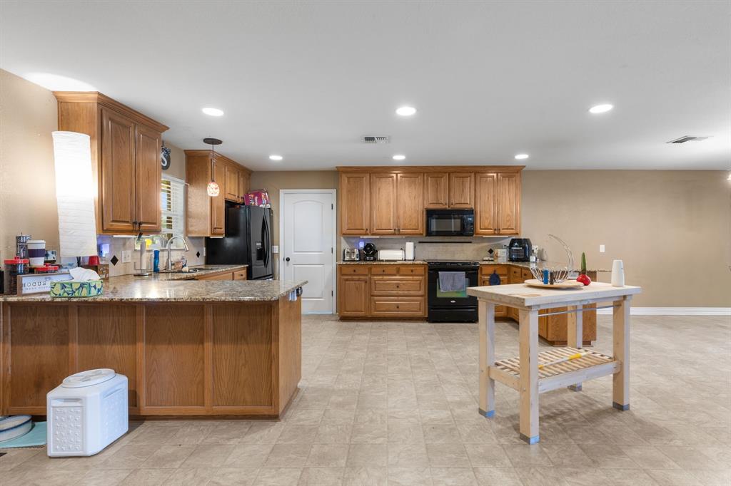 4504 Jennings Avenue Wichita Falls, TX 76310 - Photo 7 of 26 a kitchen with a sink and cabinets