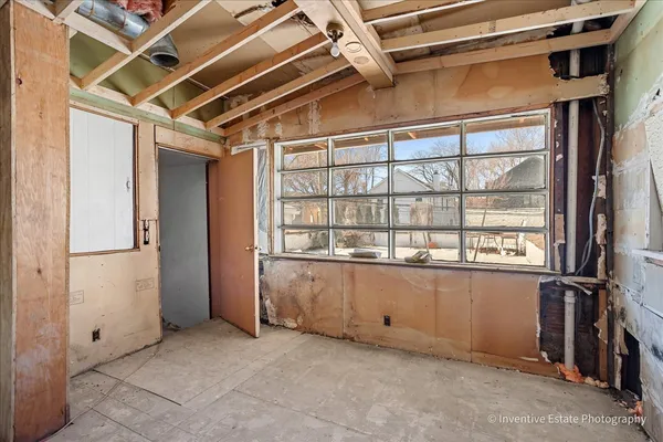 a view of an empty room with a window