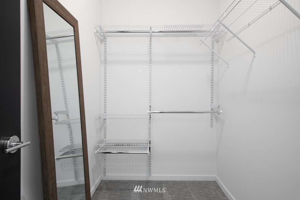 744 North 95th Street, Unit B Seattle, WA 98103 - Photo 14 of 28 a bathroom with a glass shower door