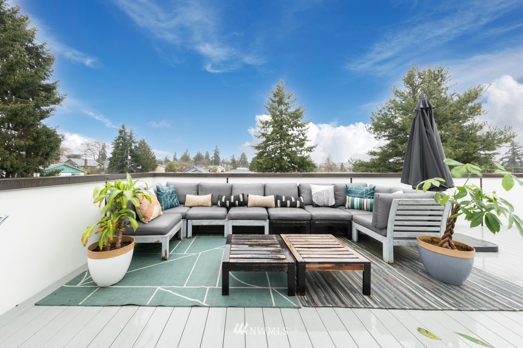 744 North 95th Street, Unit B Seattle, WA 98103 - Photo 20 of 28 a outdoor sitting area with furniture and a potted plant