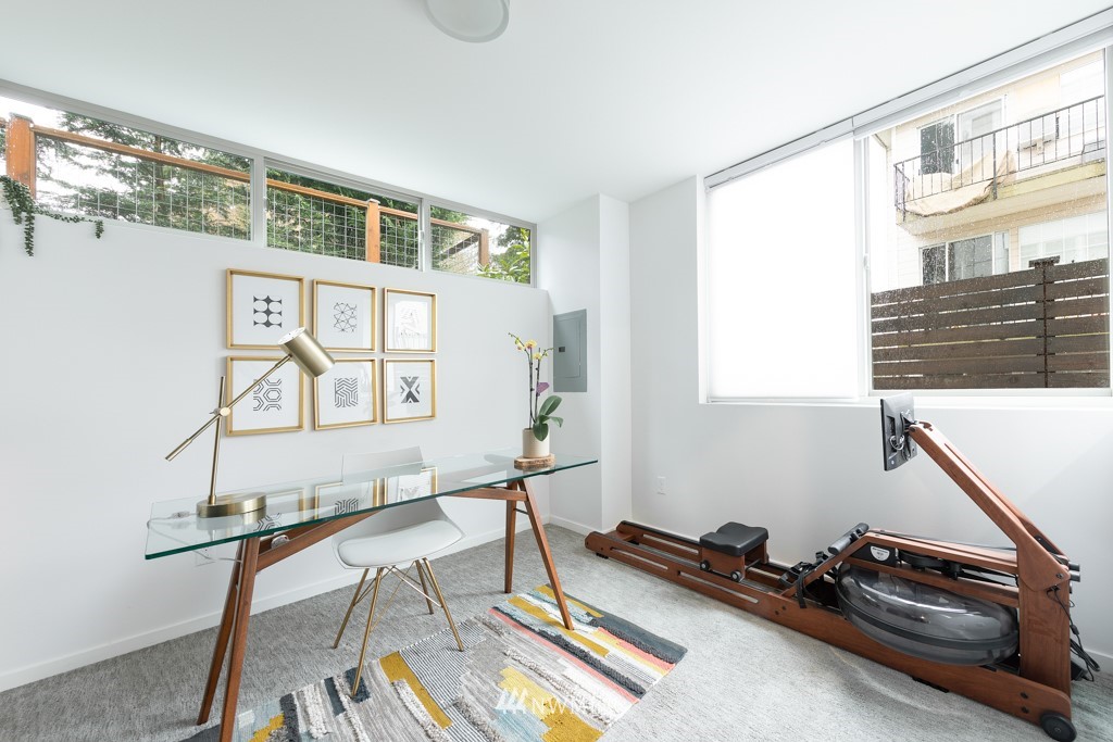 744 North 95th Street, Unit B Seattle, WA 98103 - Photo 23 of 28 a room with gym equipment and a window