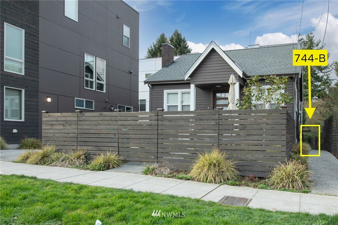 744 North 95th Street, Unit B Seattle, WA 98103 - Photo 28 of 28 a front view of a house with a yard