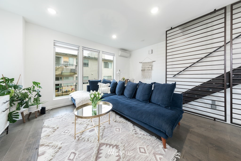 744 North 95th Street, Unit B Seattle, WA 98103 - Photo 9 of 28 a living room with furniture and a potted plant