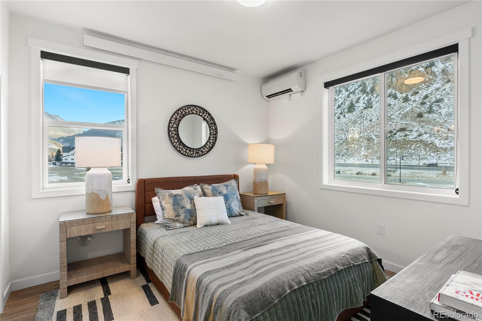 2152 Bighorn Road, Unit 204 Georgetown, CO 80444 - Photo 14 of 36 a bedroom with a large bed and a window