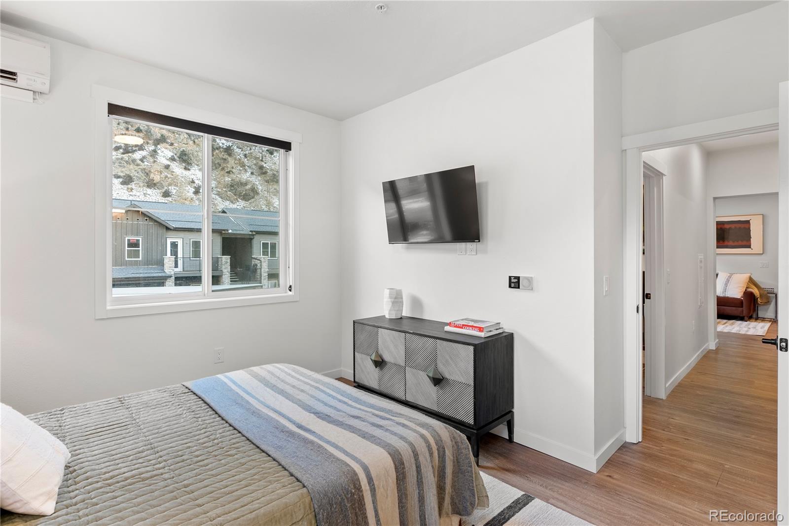 2152 Bighorn Road, Unit 204 Georgetown, CO 80444 - Photo 15 of 36 a bedroom with a bed and a flat screen tv