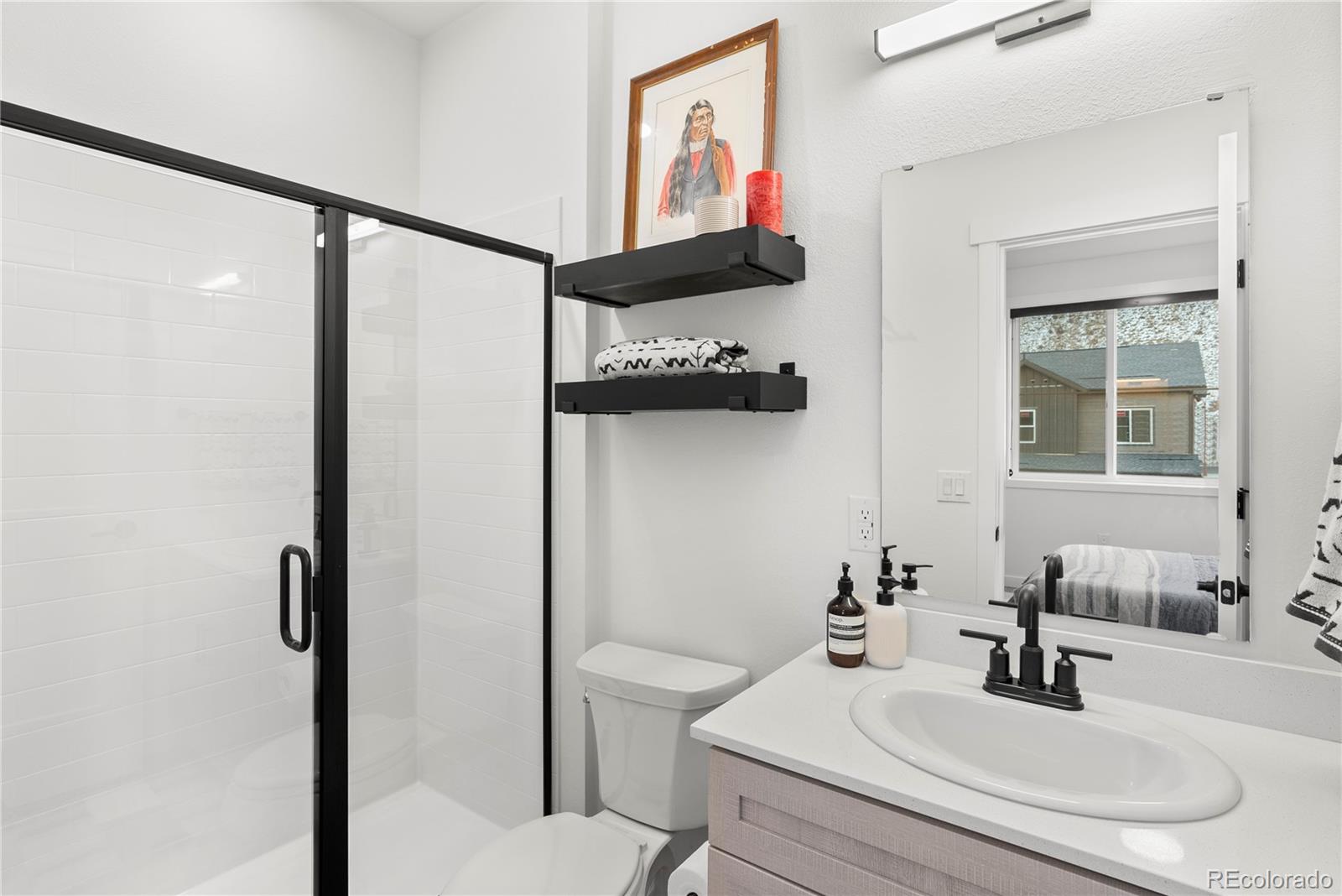 2152 Bighorn Road, Unit 204 Georgetown, CO 80444 - Photo 18 of 36 a bathroom with a sink and a mirror