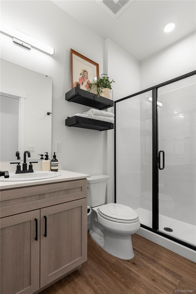 2152 Bighorn Road, Unit 204 Georgetown, CO 80444 - Photo 21 of 36 a bathroom with a toilet sink and mirror