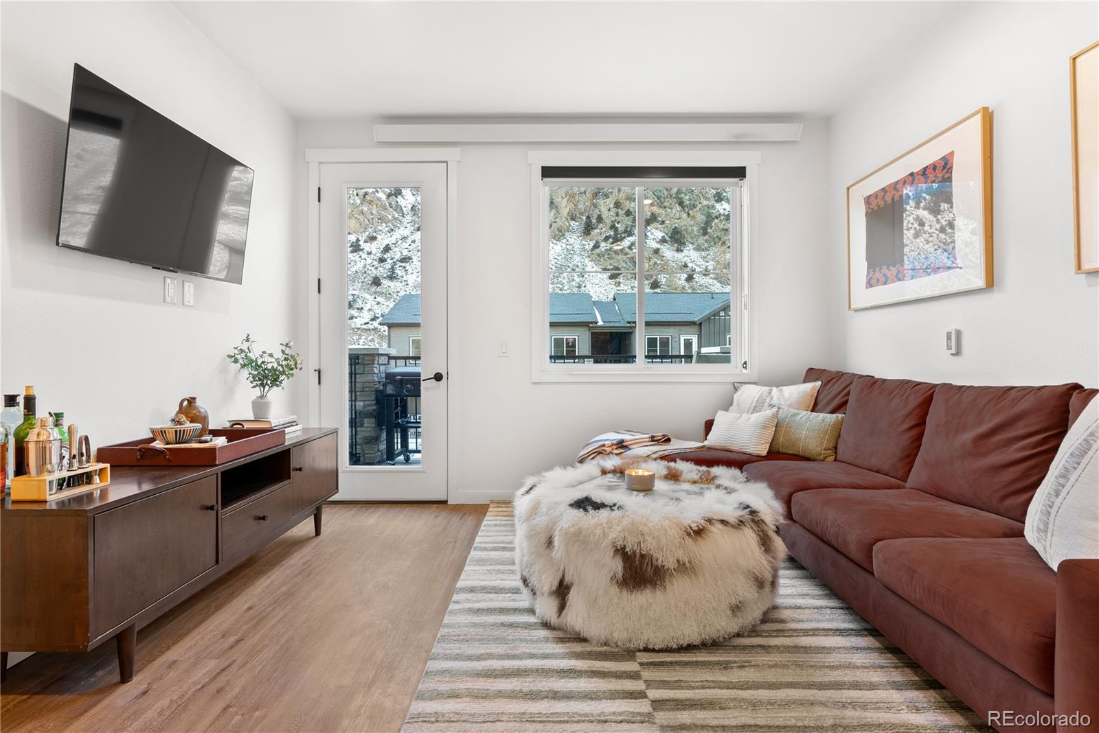 2152 Bighorn Road, Unit 204 Georgetown, CO 80444 - Photo 8 of 36 a living room with furniture and a flat screen tv