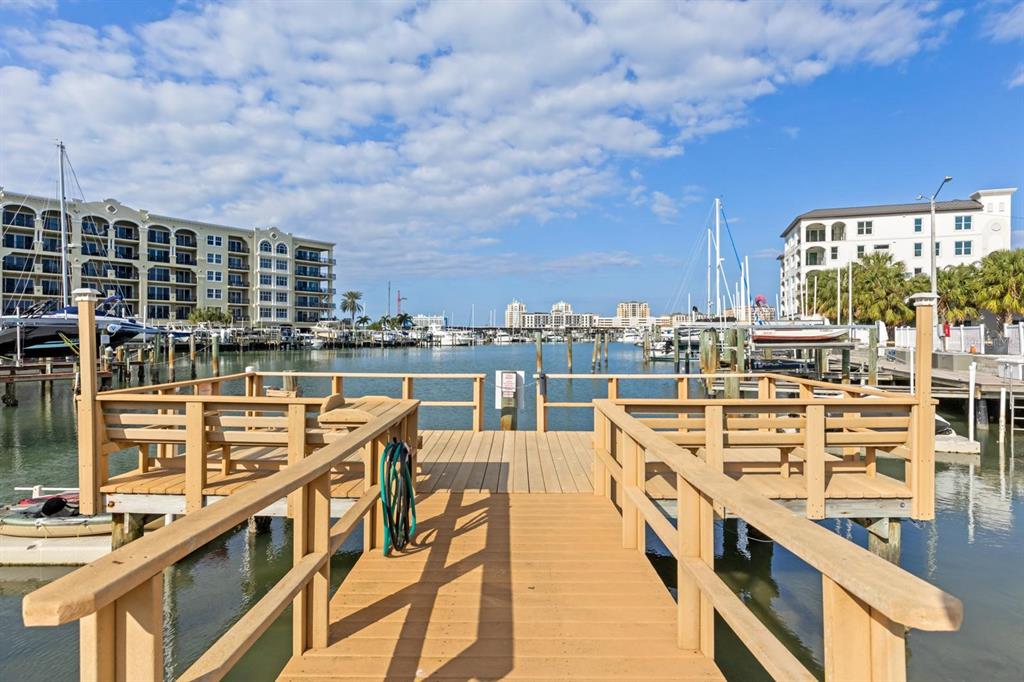 255 Dolphin Point, Unit 513 Clearwater Beach, FL 33767 - Photo 3 of 18 a view of a balcony with dining table and chairs