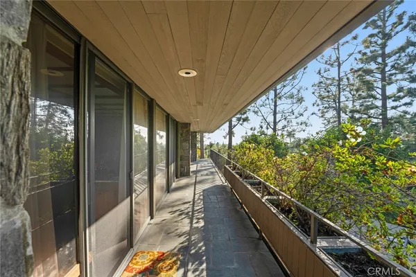 a bedroom with furniture and a flat screen tv