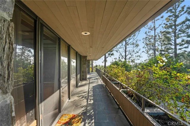 a bedroom with furniture and a flat screen tv