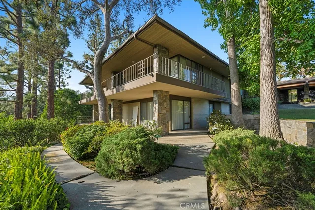 a kitchen with stainless steel appliances granite countertop a sink counter space cabinets and a large window