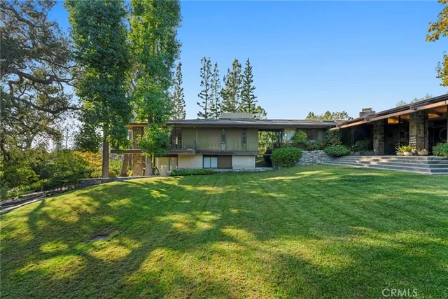 a kitchen with stainless steel appliances granite countertop a sink counter space cabinets and a window