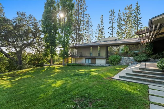 a kitchen with stainless steel appliances and white cabinets