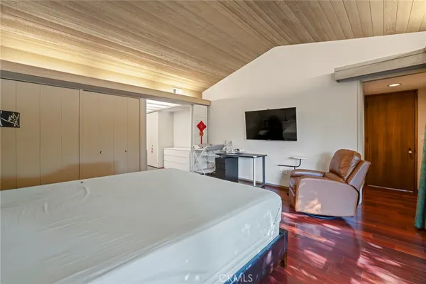 a living room with fireplace furniture and a large window