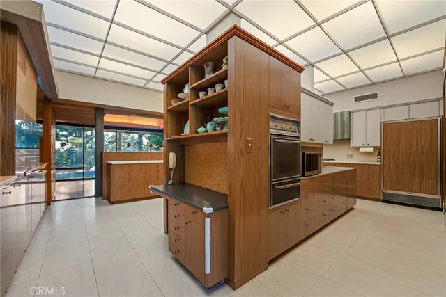 a living room with furniture a wooden floor and a fireplace