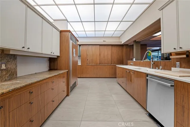 a bedroom with furniture and a flat screen tv