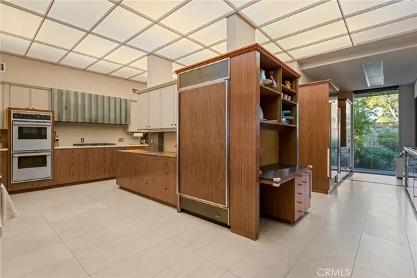 a bathroom with a double vanity sink and mirror