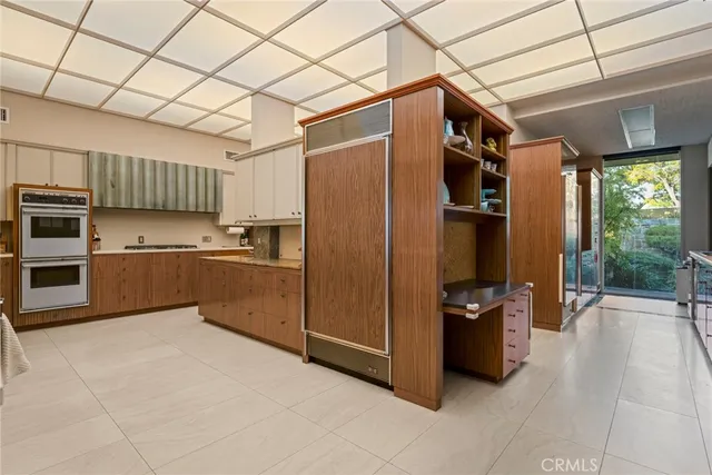 a bathroom with a double vanity sink and mirror