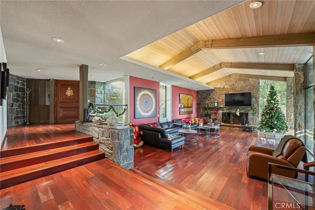 a bathroom with a granite countertop sink a mirror and shower