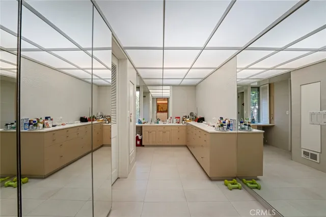 an aerial view of a house with a yard and lake view