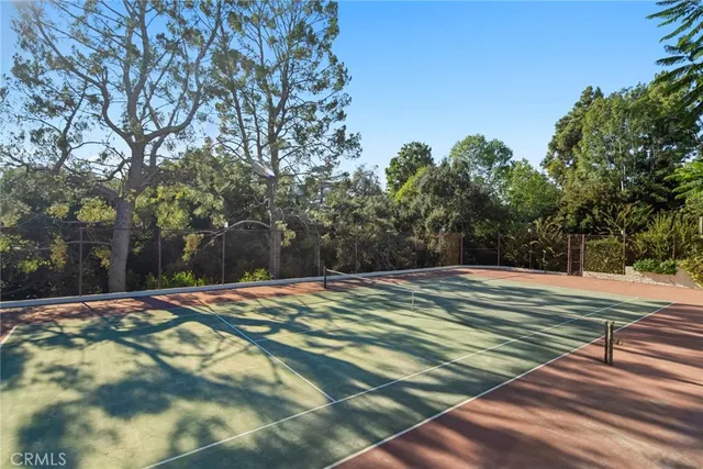 a view of backyard with outdoor seating and green space