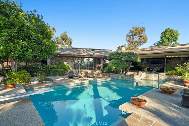 a view of a backyard with a garden and plants