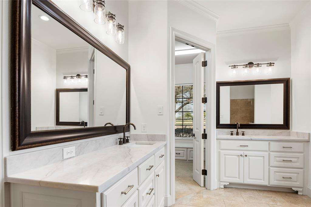 700 Frenchtown Road Argyle, TX 76226 - Photo 20 of 40 Gorgeous finishes accent the Primary bathroom with dual vanities, walk-in shower, jetted tub and a massive custom built walk in closet.