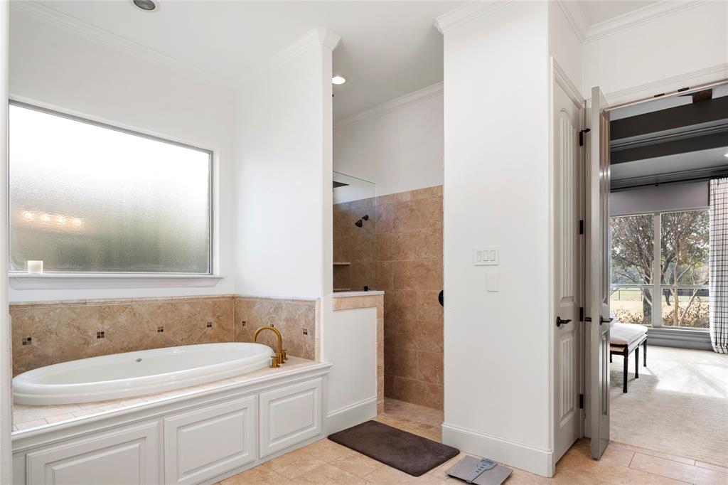 700 Frenchtown Road Argyle, TX 76226 - Photo 21 of 40 Jetted Tub and walk-in shower with 2 separate spray heads.