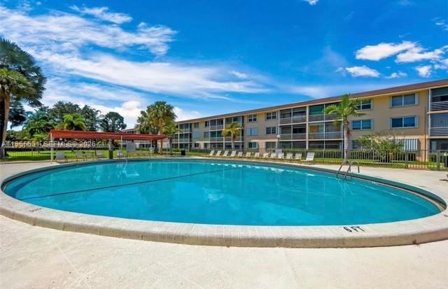 4502 North Federal Highway, Unit 336D Lighthouse Point, FL 33064 - Photo 17 of 20 a view of a swimming pool with a patio