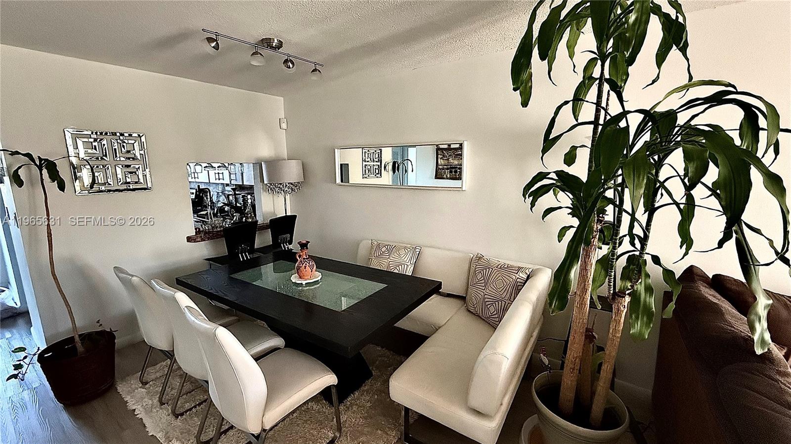 4502 North Federal Highway, Unit 336D Lighthouse Point, FL 33064 - Photo 3 of 20 a view of a dining room with furniture and wooden floor