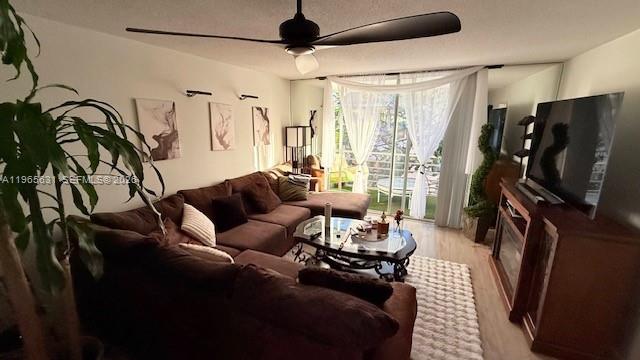 4502 North Federal Highway, Unit 336D Lighthouse Point, FL 33064 - Photo 5 of 20 a living room with furniture a flat screen tv and a window