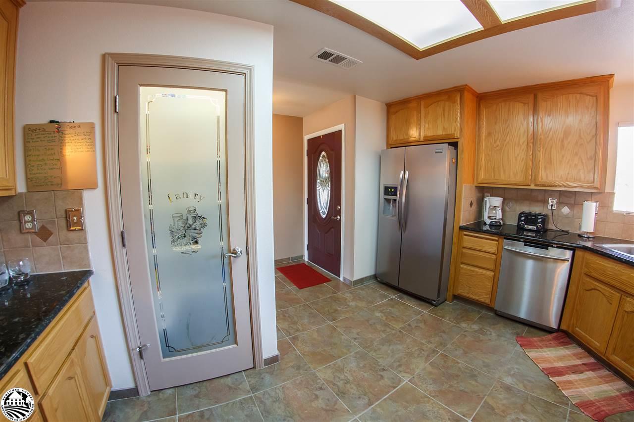 2112 Quail Hill Road Copperopolis, CA 95228 - Photo 11 of 22 a kitchen with stainless steel appliances granite countertop a refrigerator and a sink