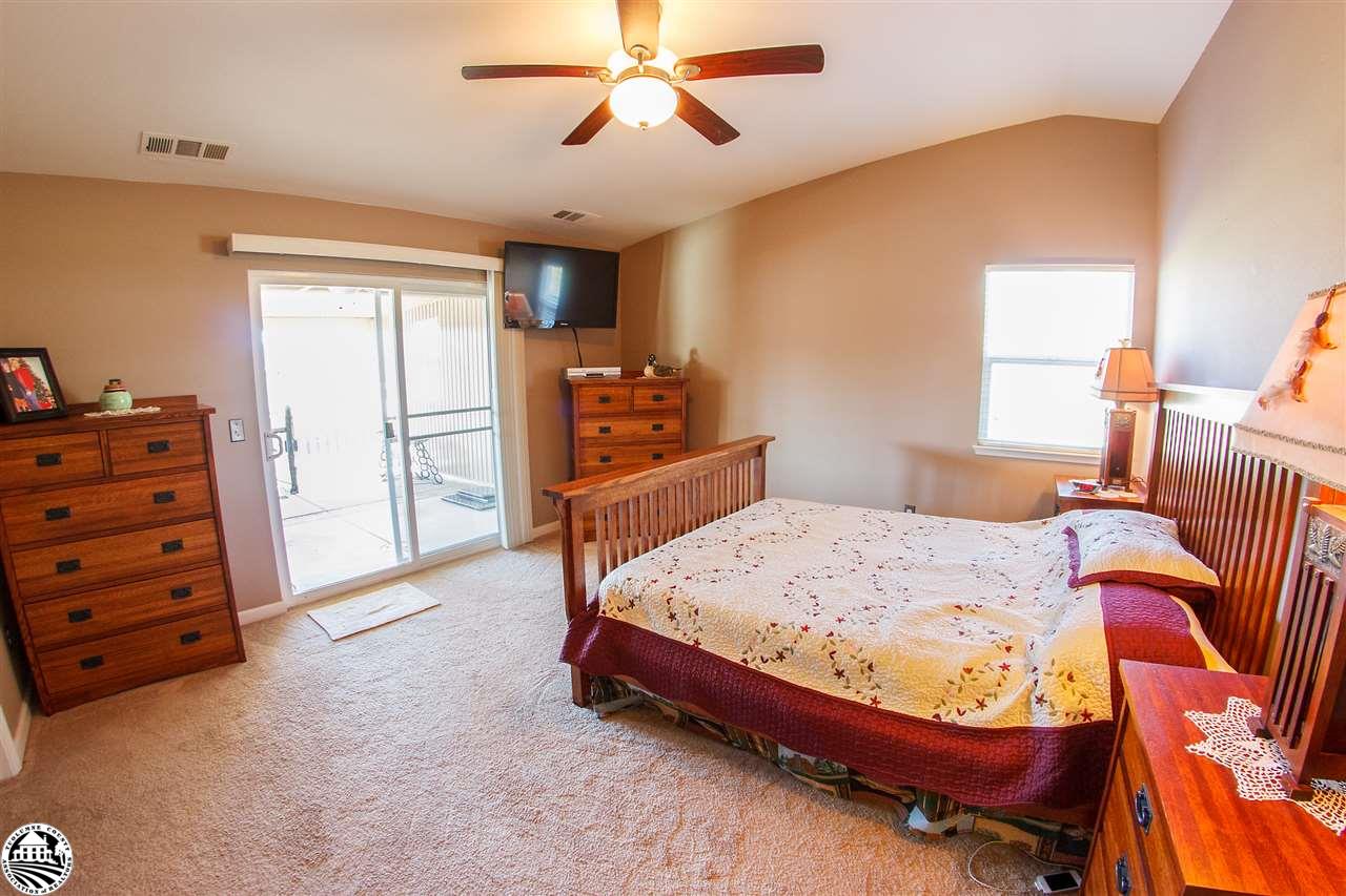 2112 Quail Hill Road Copperopolis, CA 95228 - Photo 20 of 22 a bed room with a bed and a television