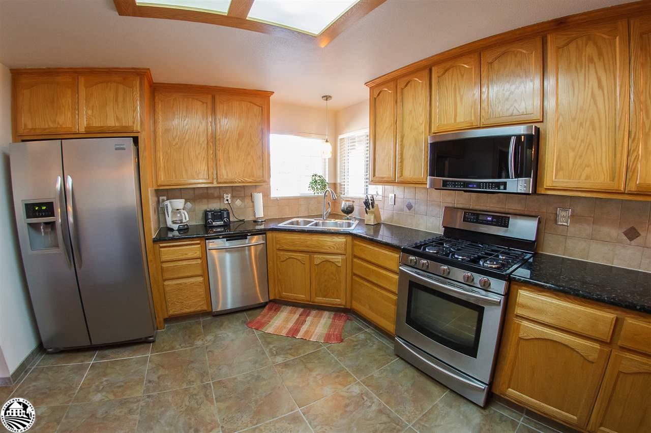 2112 Quail Hill Road Copperopolis, CA 95228 - Photo 10 of 22 a kitchen with cabinets stainless steel appliances and window