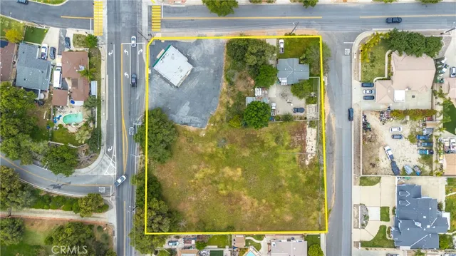 a view of a lake with houses in the back