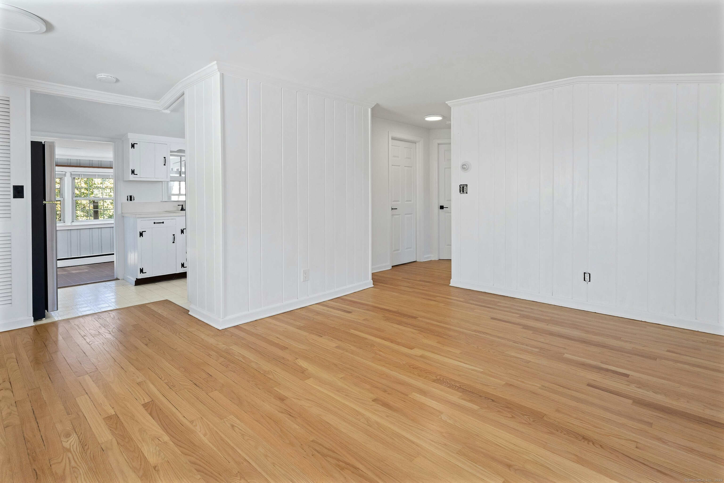 80 Victory Street Stamford, CT 06902 - Photo 7 of 12 a view of empty room with wooden floor